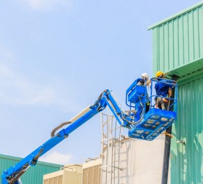 Boom lift accessing rooftop for maintenance.