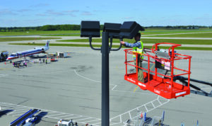 65ft Telescopic / Straight Boom Lift used for airport lighting maintenance and elevated access operations on an airfield.
