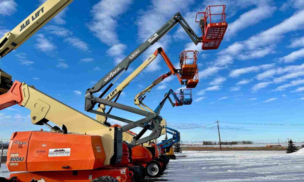 800AJ articulating boom lift, what is a manlift example with multiple boom lifts extended on a snowy outdoor job site.