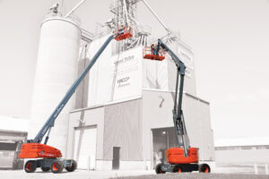 65ft Telescopic / Straight Boom Lift supporting elevated industrial maintenance work at a grain processing facility.