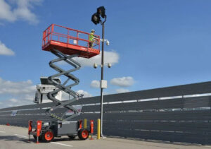 Scissor lift raised to working height showing how high scissor lifts can go.